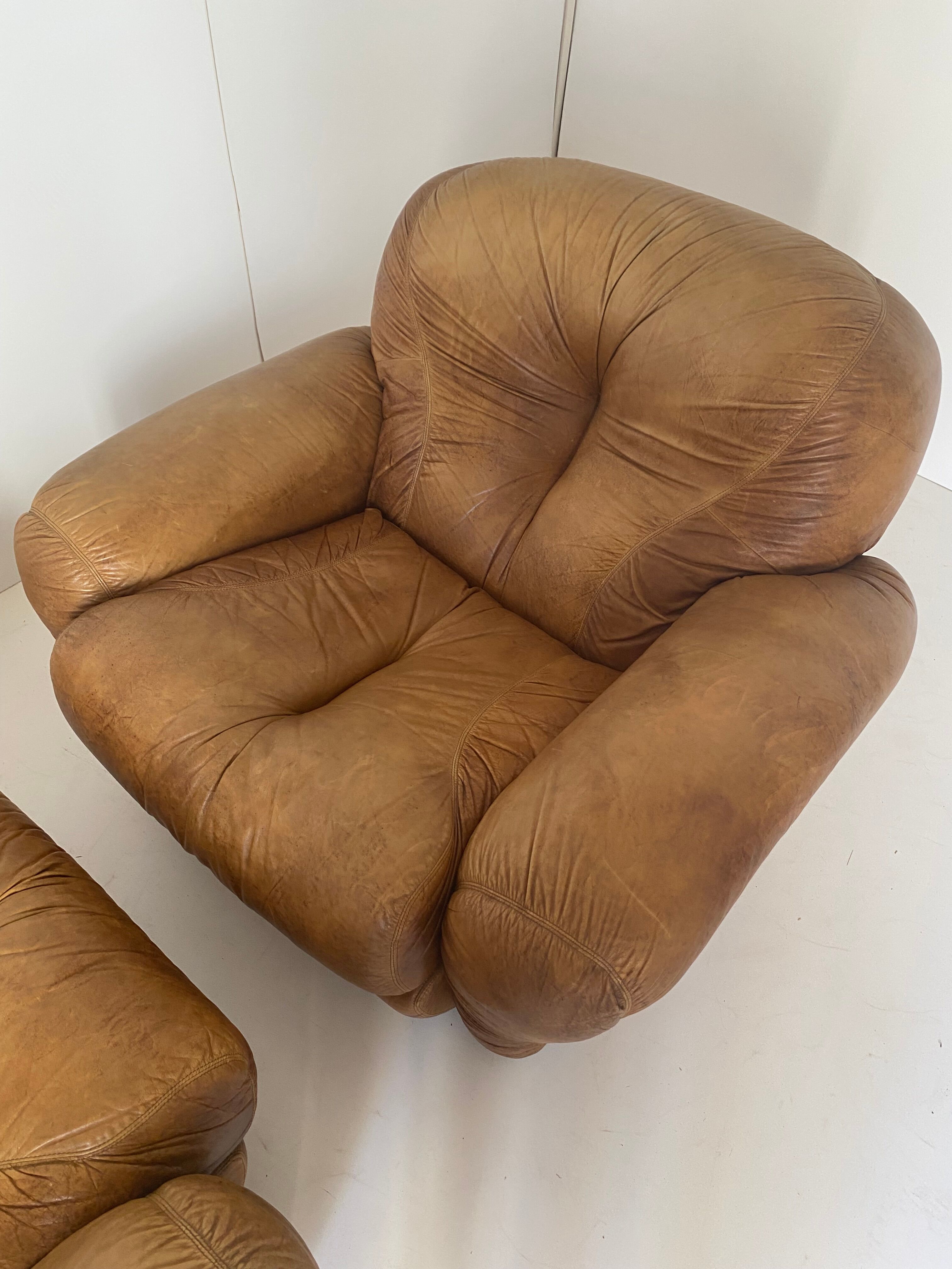 Pair of brown leather armchairs