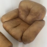 Pair of brown leather armchairs
