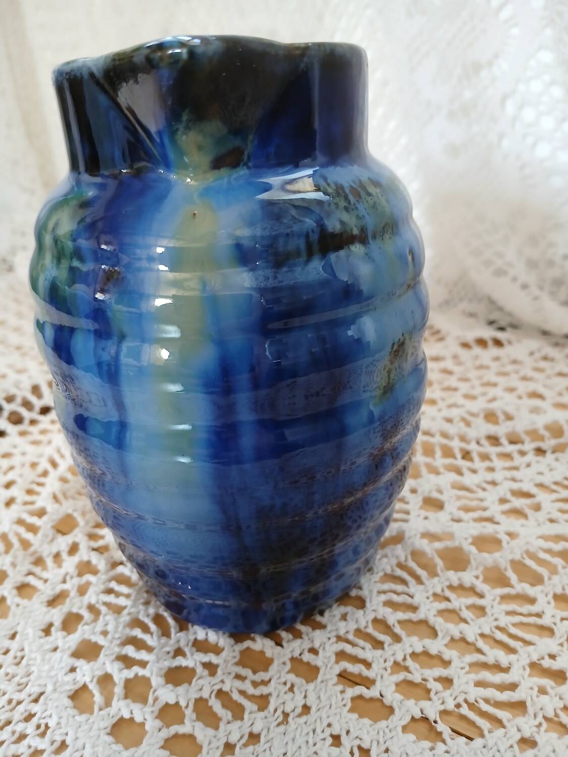 Antique pitcher in enamelled ceramic