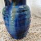 Antique pitcher in enamelled ceramic