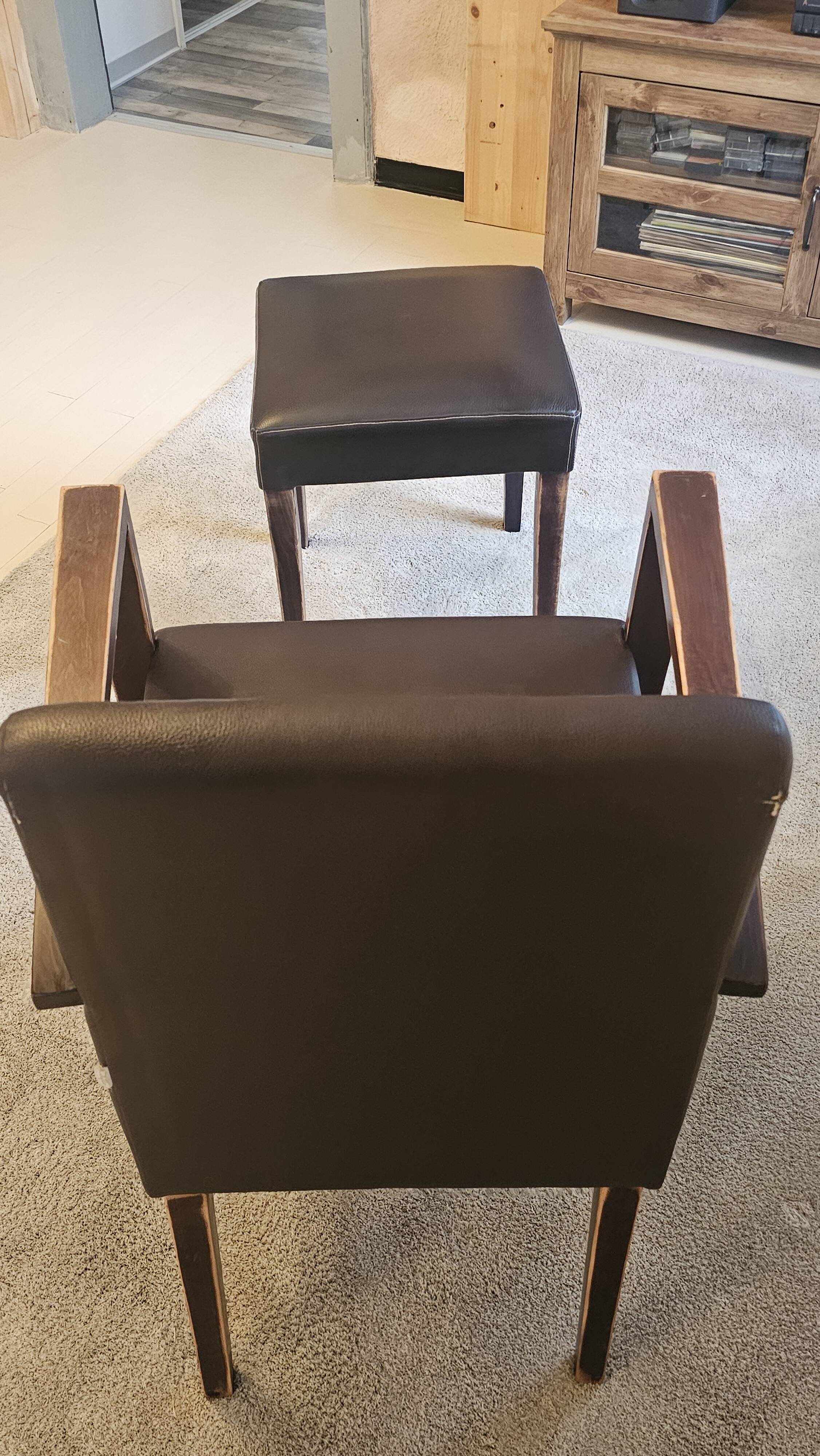 Armchair and faux leather footrest