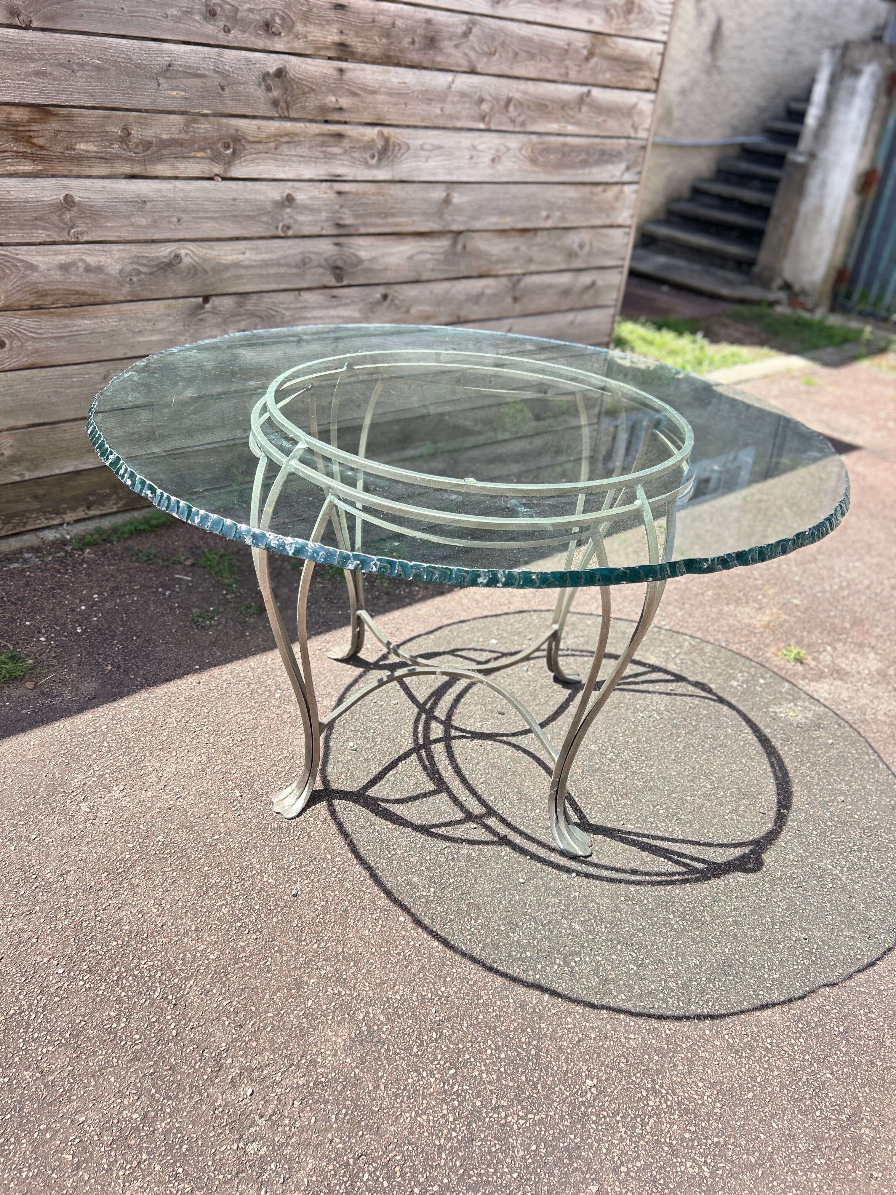 Table ronde en verre et fer forgé