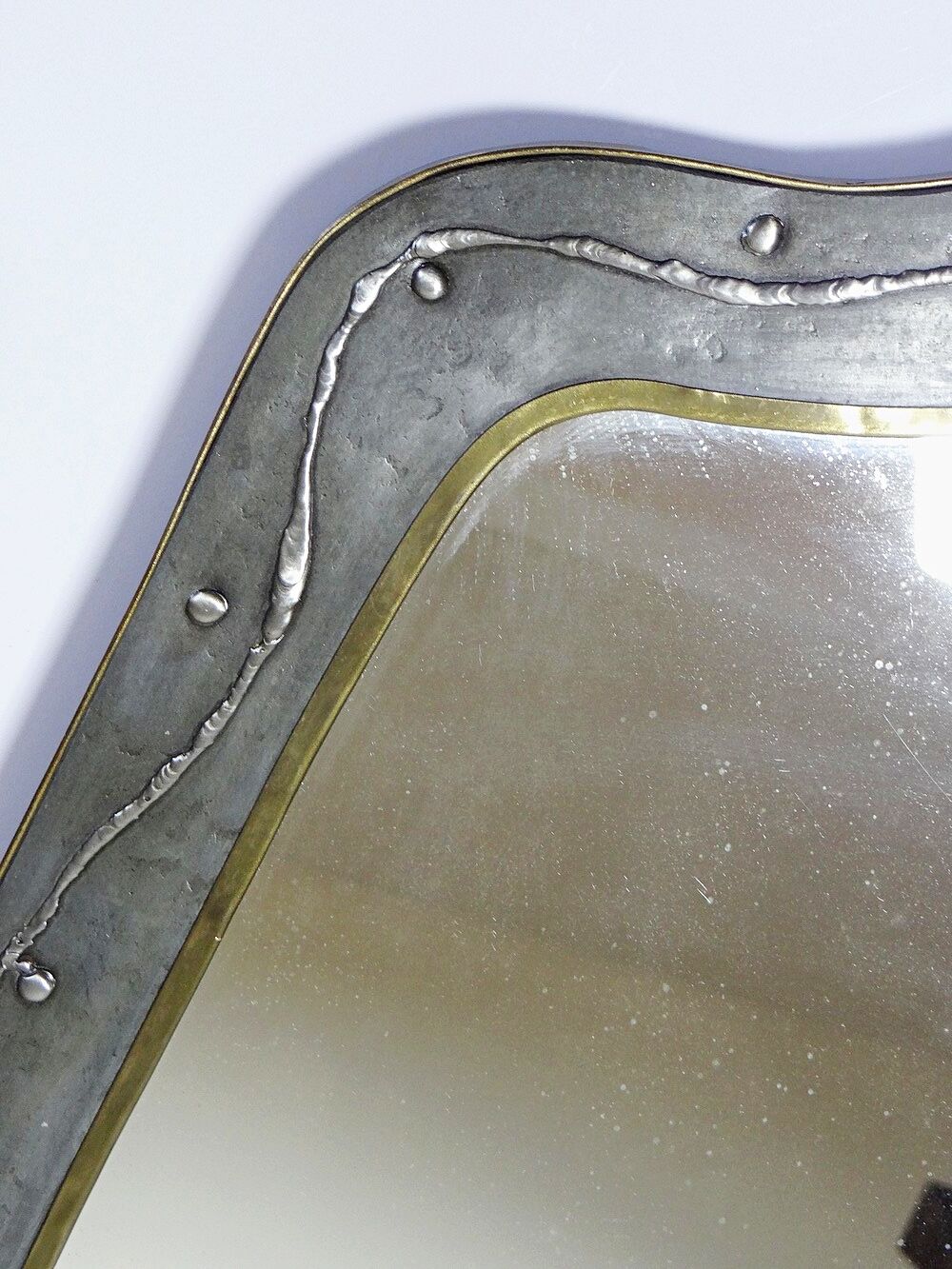 Brutalist mirror by Jean Goardère, brass and tin, 1970s.