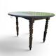Antique drop-leaf table in wood, with turned legs and castors.