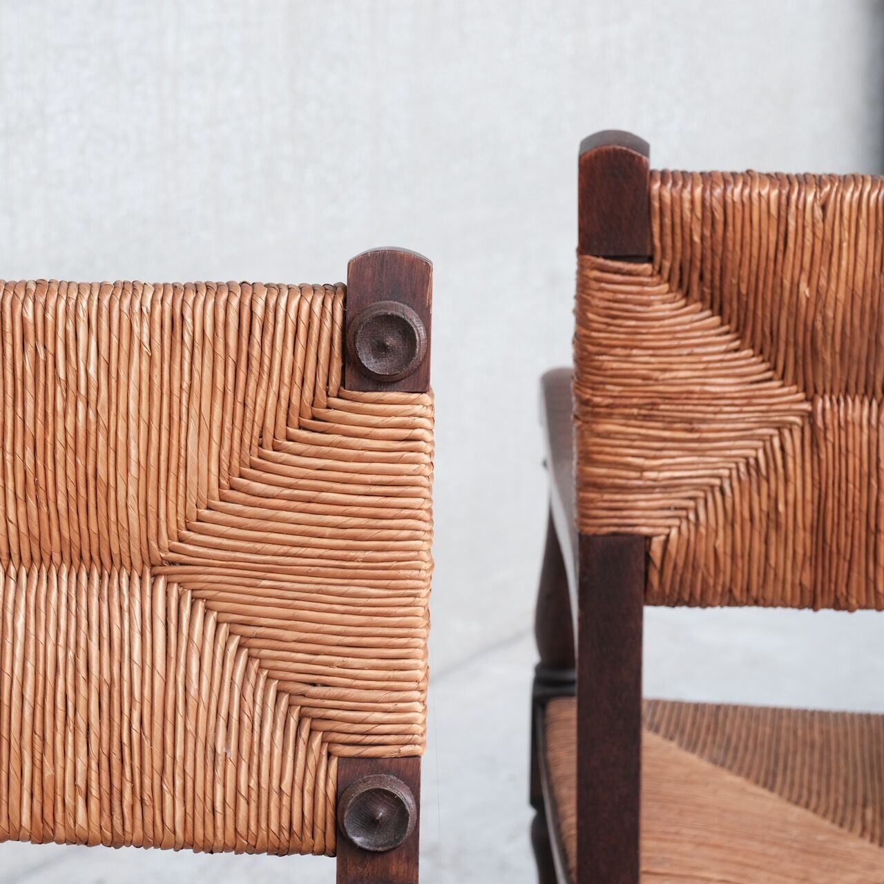 Pair of mid-century oak and rush french armchairs