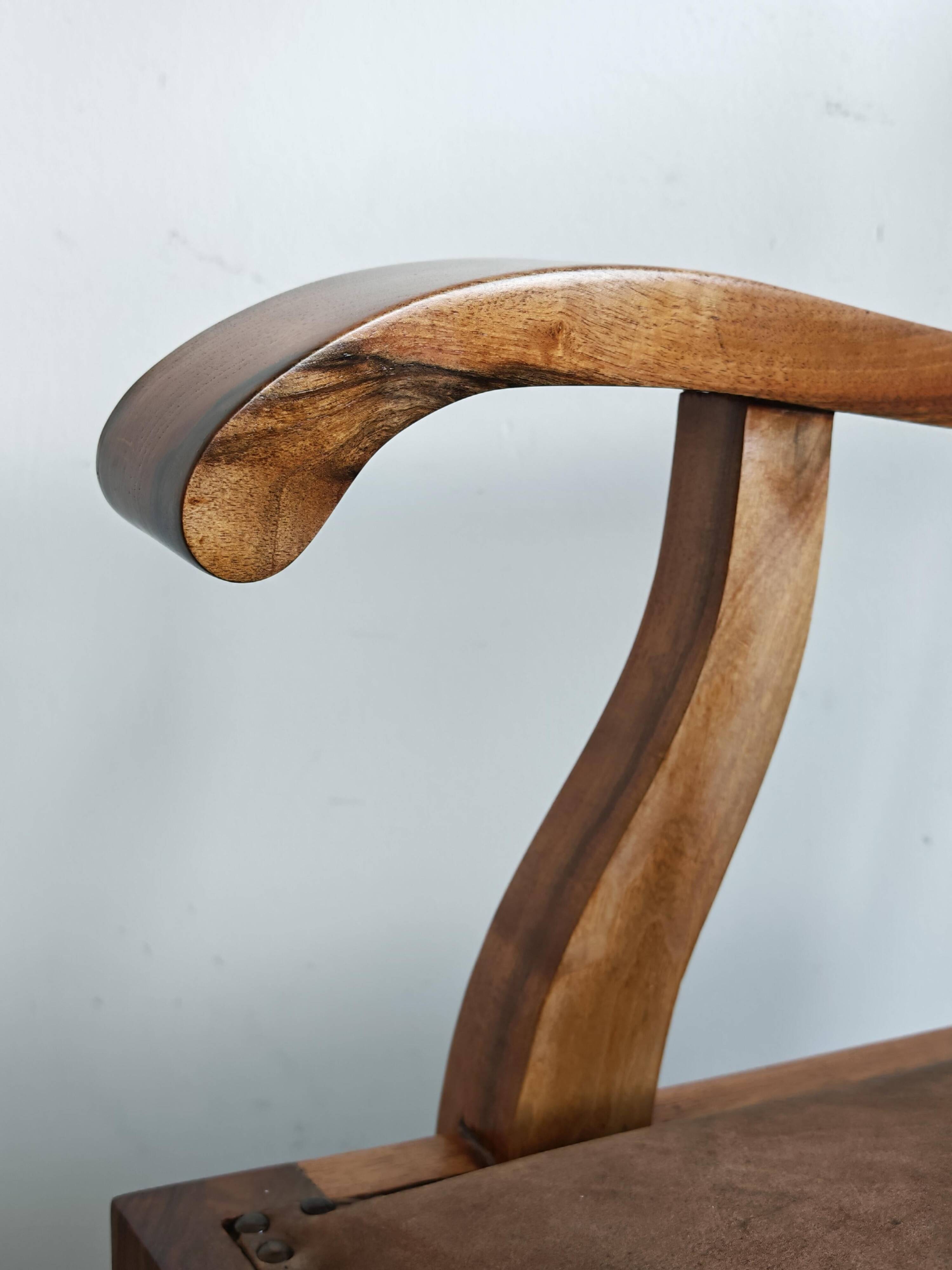 Pair of Art Deco armchairs in solid walnut and leather, 1920s