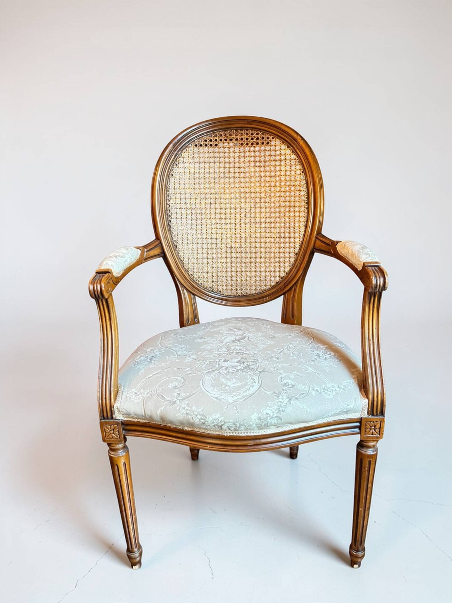 Louis XVI style medallion armchair with caning, 20th century.