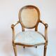 Louis XVI style medallion armchair with caning, 20th century.