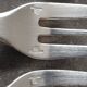 Set of 12 dessert forks and a cake server.