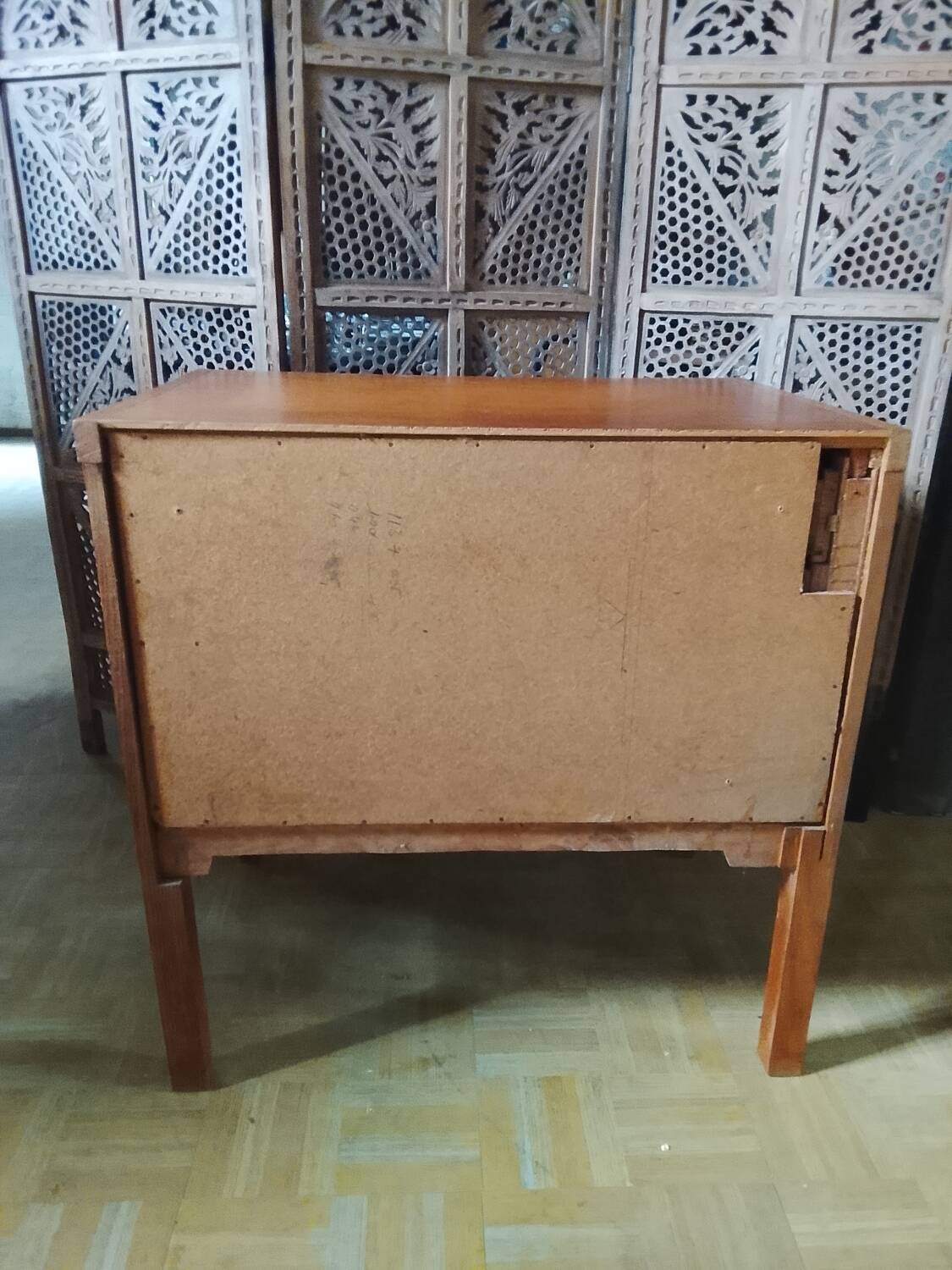 Vintage storage unit with two doors and four drawers.