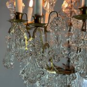 Bronze cage chandelier adorned with molded glass pendants in the shape of peacock feathers, circa 1800