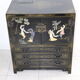 Black lacquered Chinese buffet with stone and ivory figures
