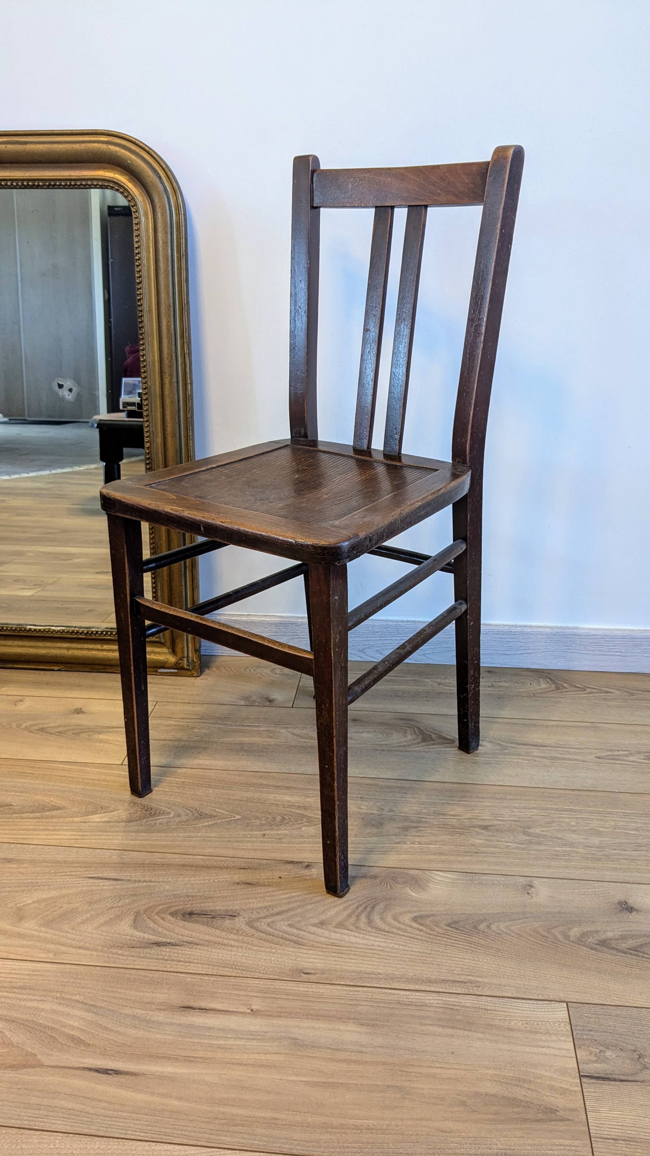 Pair of 1930s bistro chairs with patinated wood.