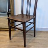 Pair of 1930s bistro chairs with patinated wood.