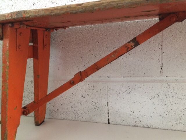 Orange folding wooden bench