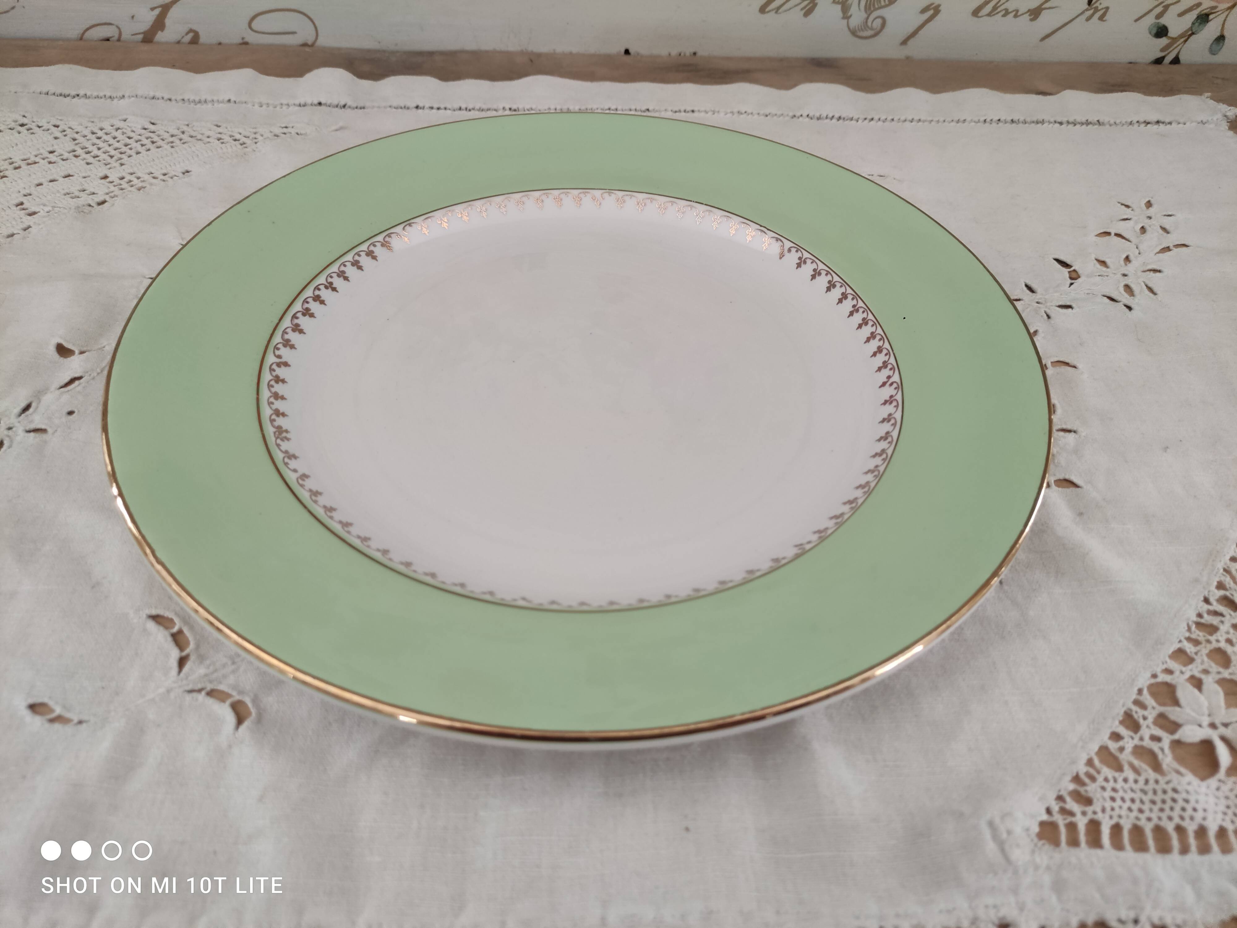 Round plate with aqua green rim and golden frieze, Cafés Lemaire.