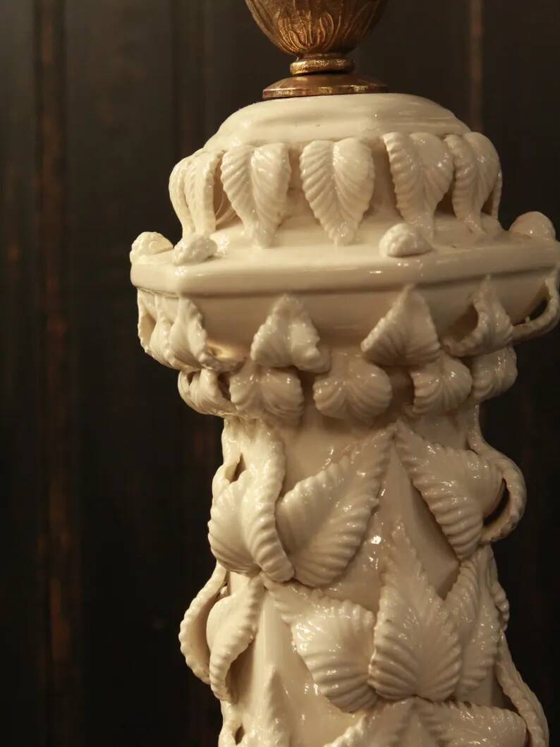 Vintage white ceramic table lamp from Manises with a raised leaf design.