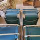 4 vintage Italian armchairs in green leather and chrome metal.