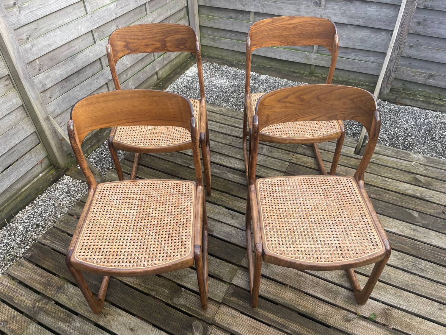 4 magnificent Baumann sled chairs, with caning.