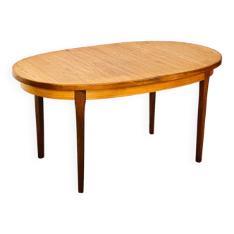 Oval teak dining table with extension