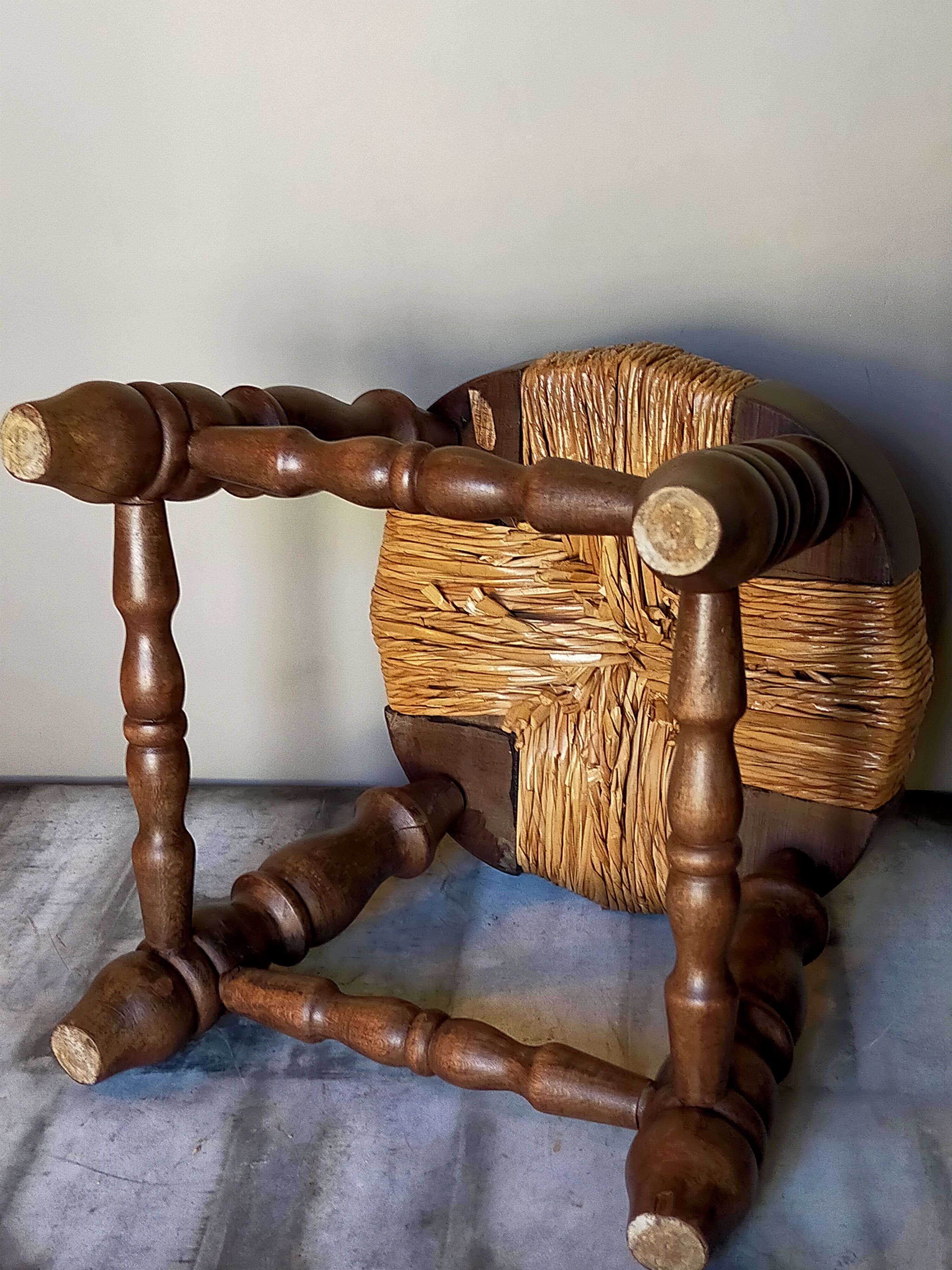 Low vintage regional stool in solid wood with straw top