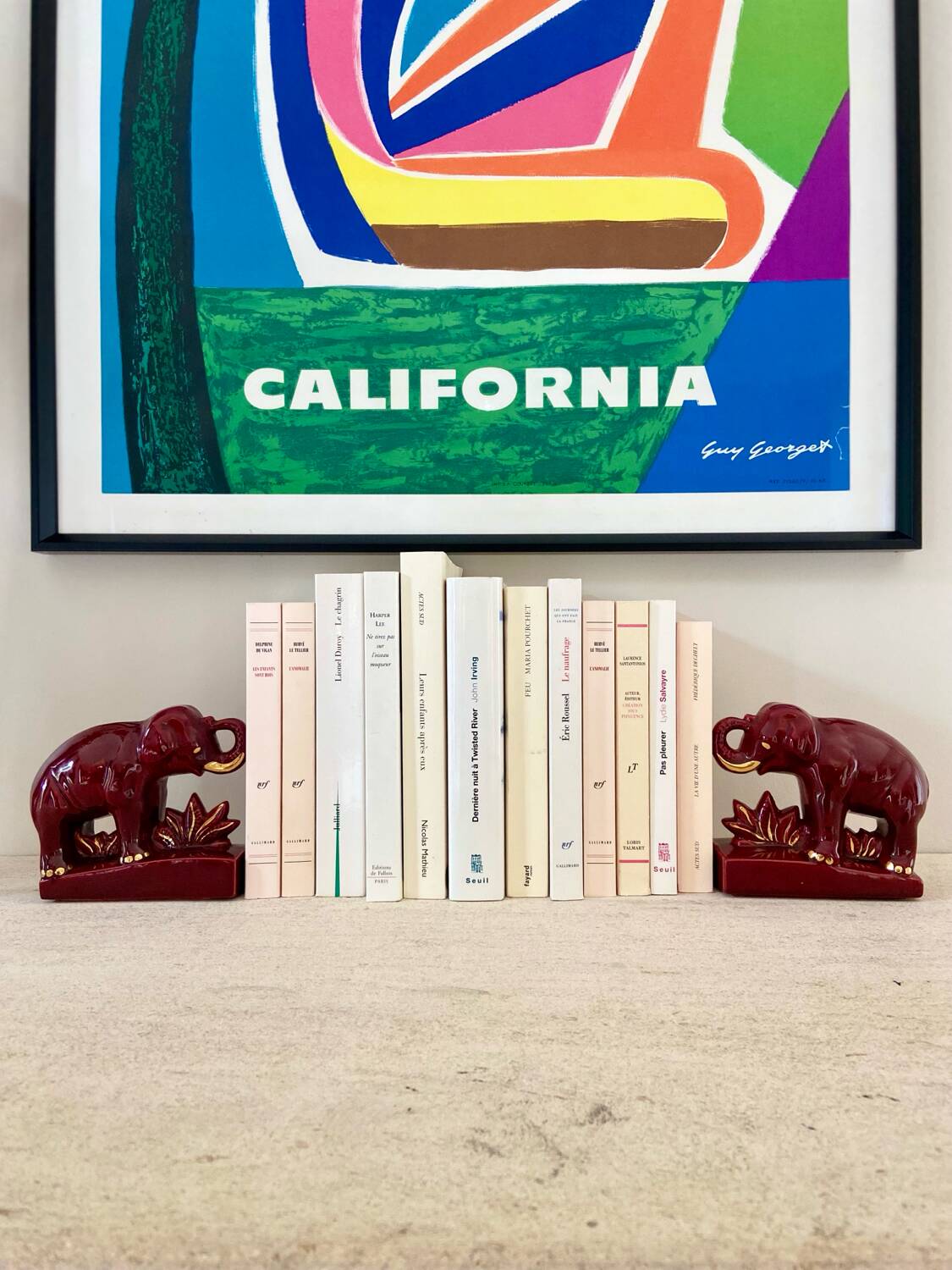 Pair of burgundy ceramic “Elephants” bookends