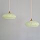 Pair of Art Deco light fixtures in light green speckled glass, 1930s.