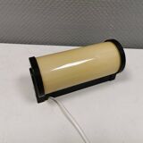 Old wall lamp, made of bakelite with a vanilla/egg colored glass shade.