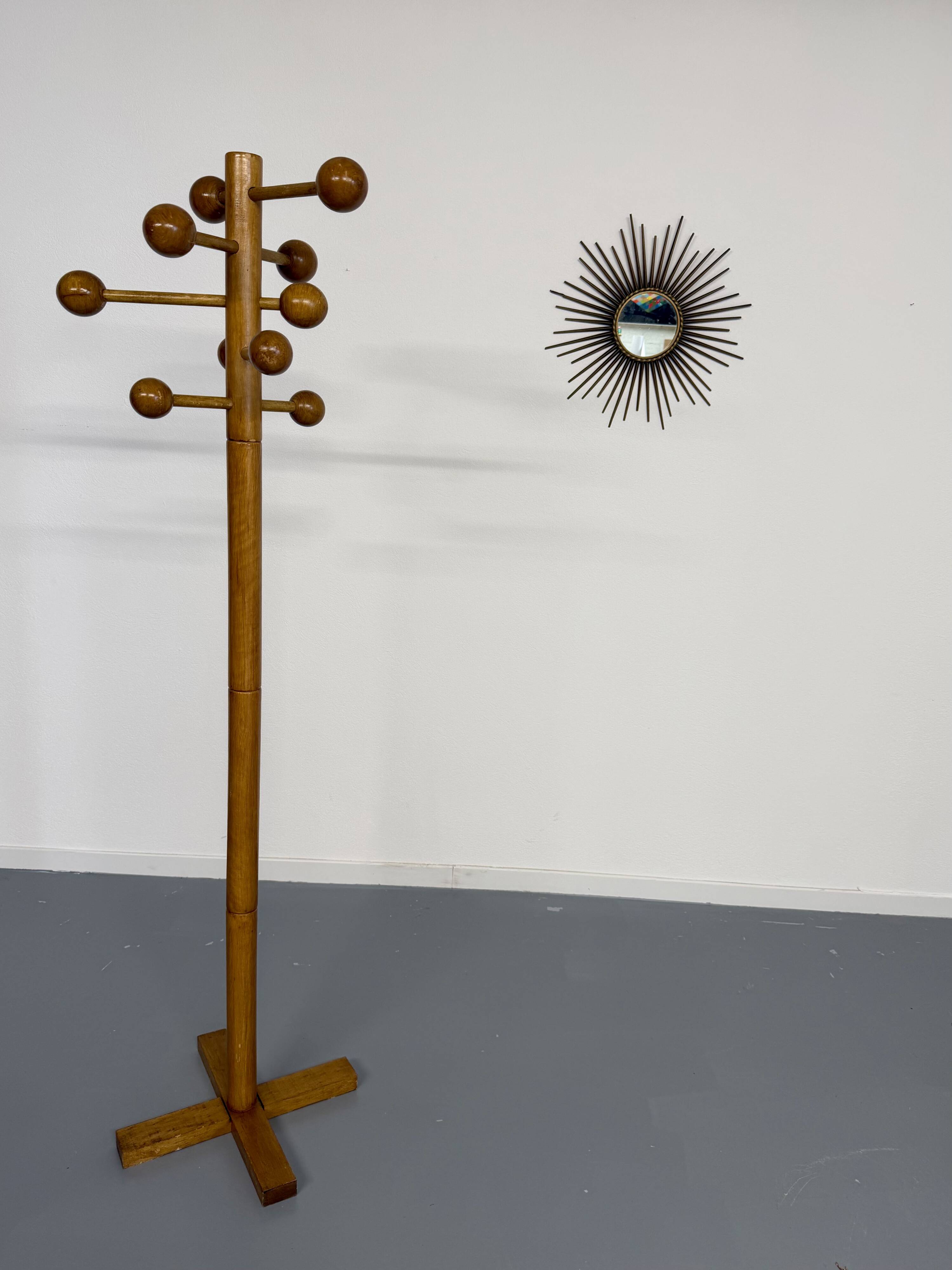 Vintage wooden coat stand with modernist design from the 1970s.