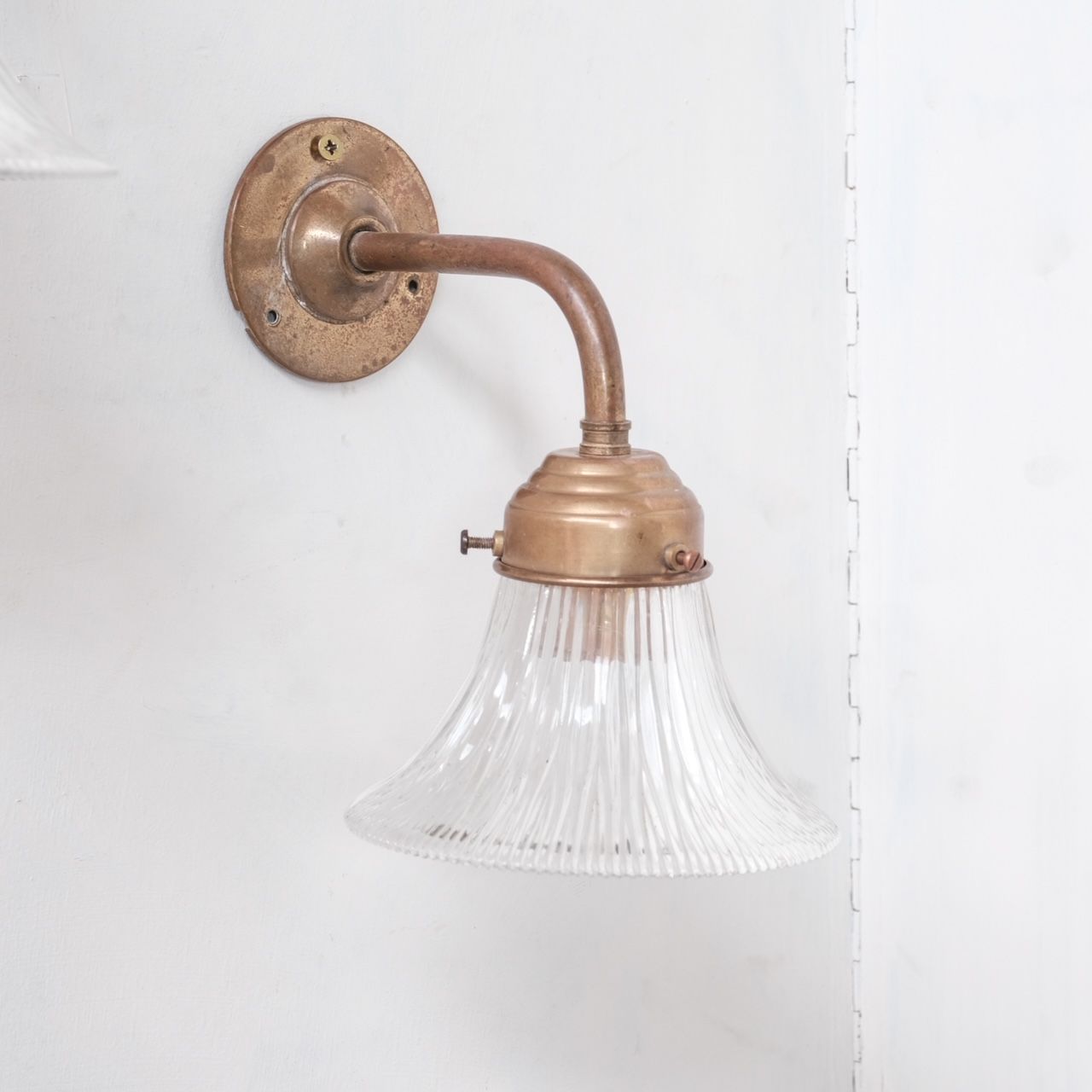 Pair of brass and holophane glass french mid-century wall lights