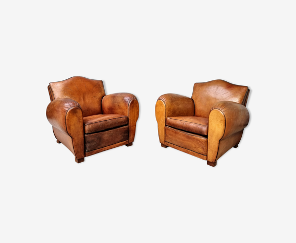 Paire de fauteuils club en cuir
