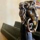 Pair of antique fire dogs with lion heads - patinated cast iron