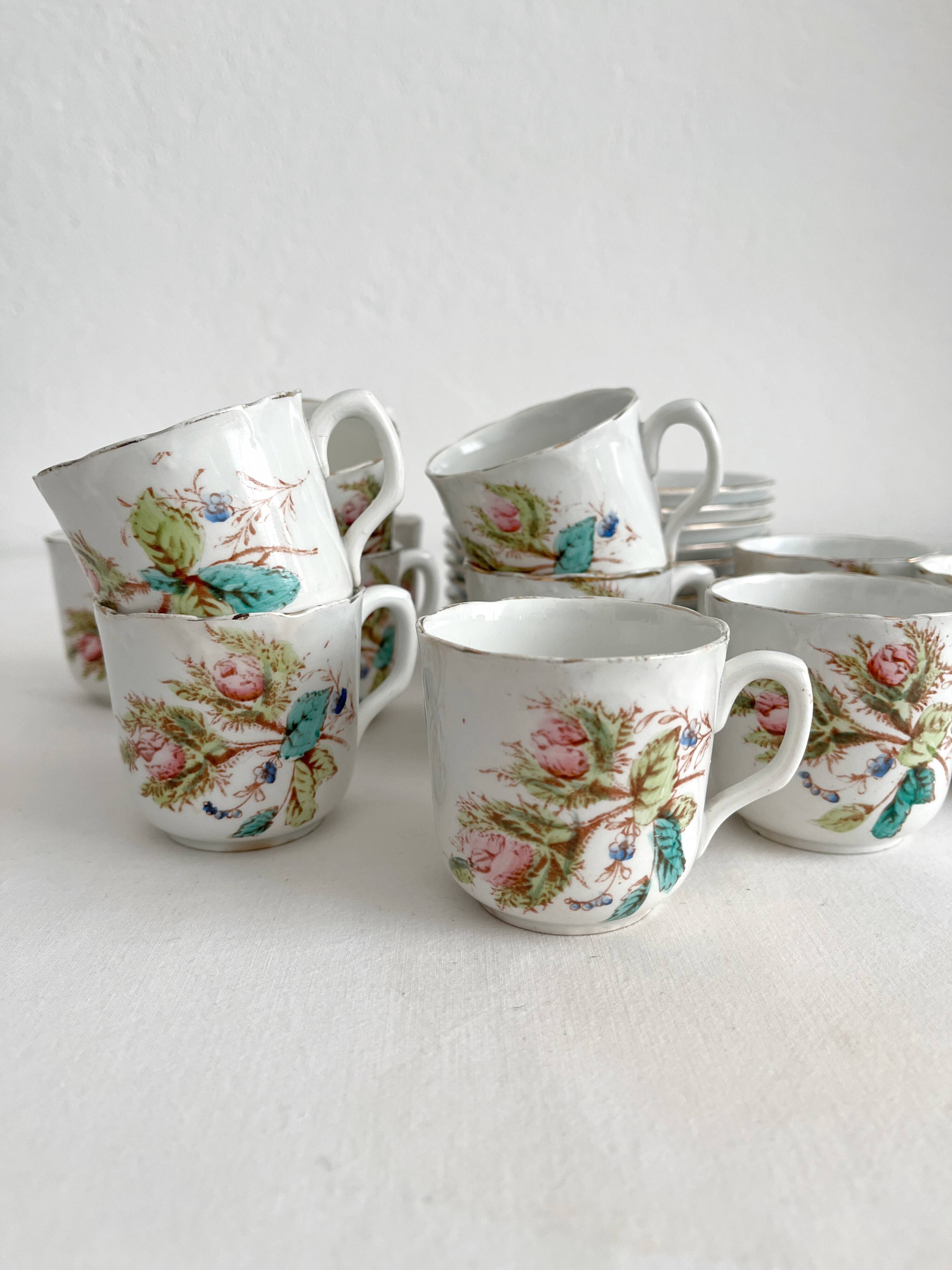 12 ironstone coffee cups with polychrome floral decoration, KG Lunéville