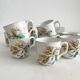 12 ironstone coffee cups with polychrome floral decoration, KG Lunéville