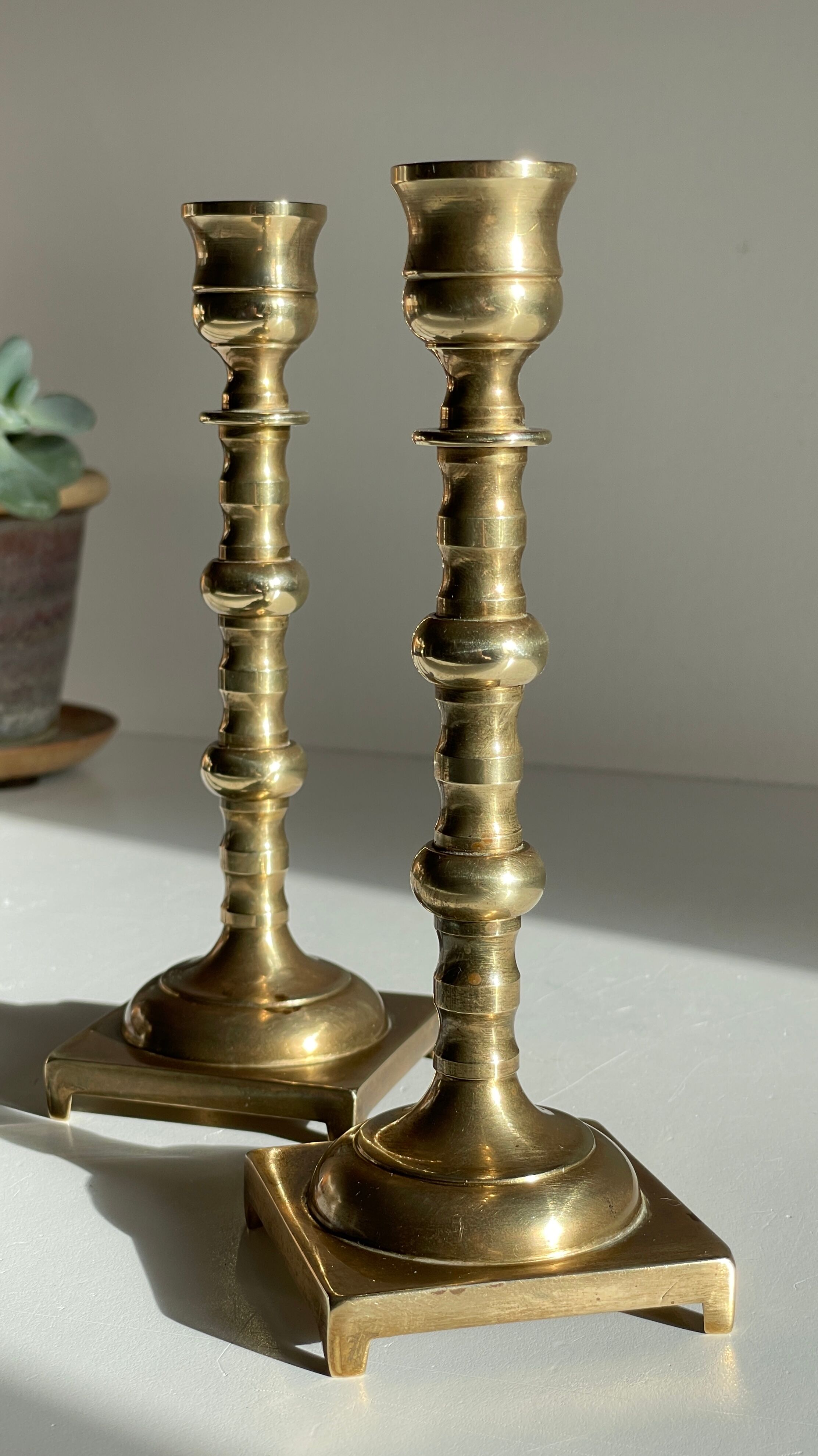 Pair of brass candle holders made in England