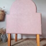Single bar stool in pink stitched faux leather.