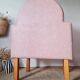 Single bar stool in pink stitched faux leather.