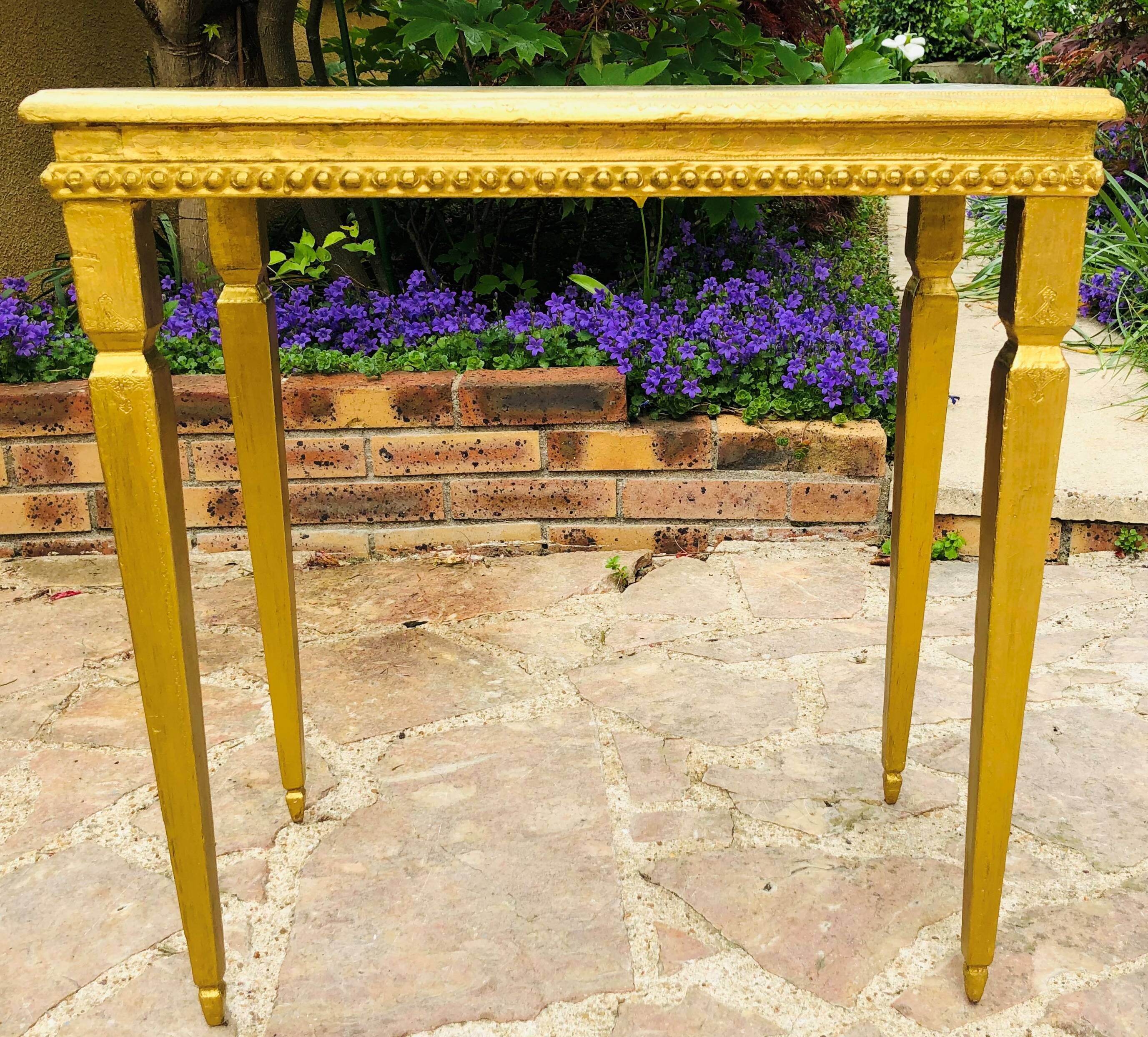 Coffee table in gilded wood