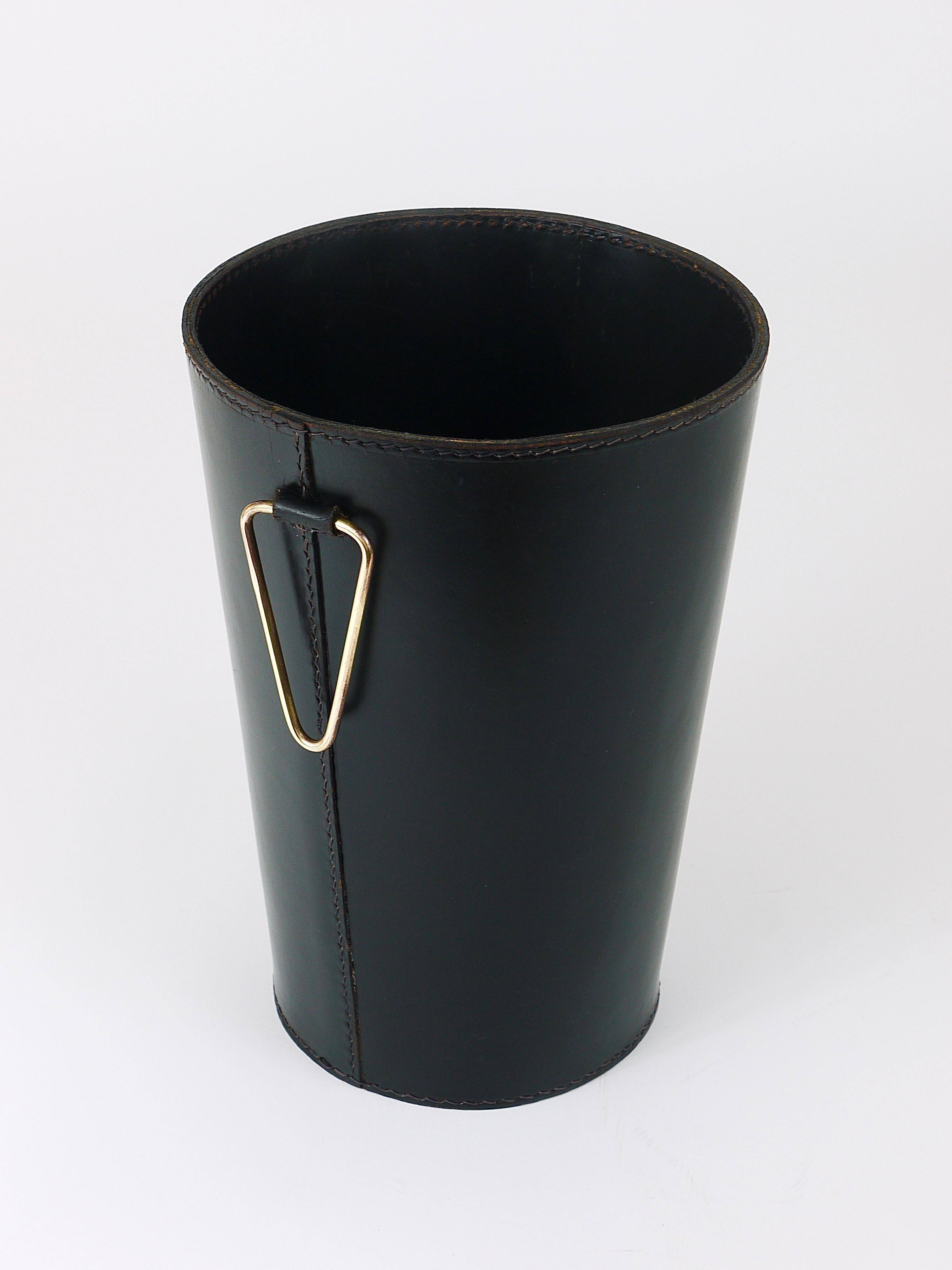 Mid-Century paper bin by Carl Auböck in black leather and brass, Austria, 1950s.