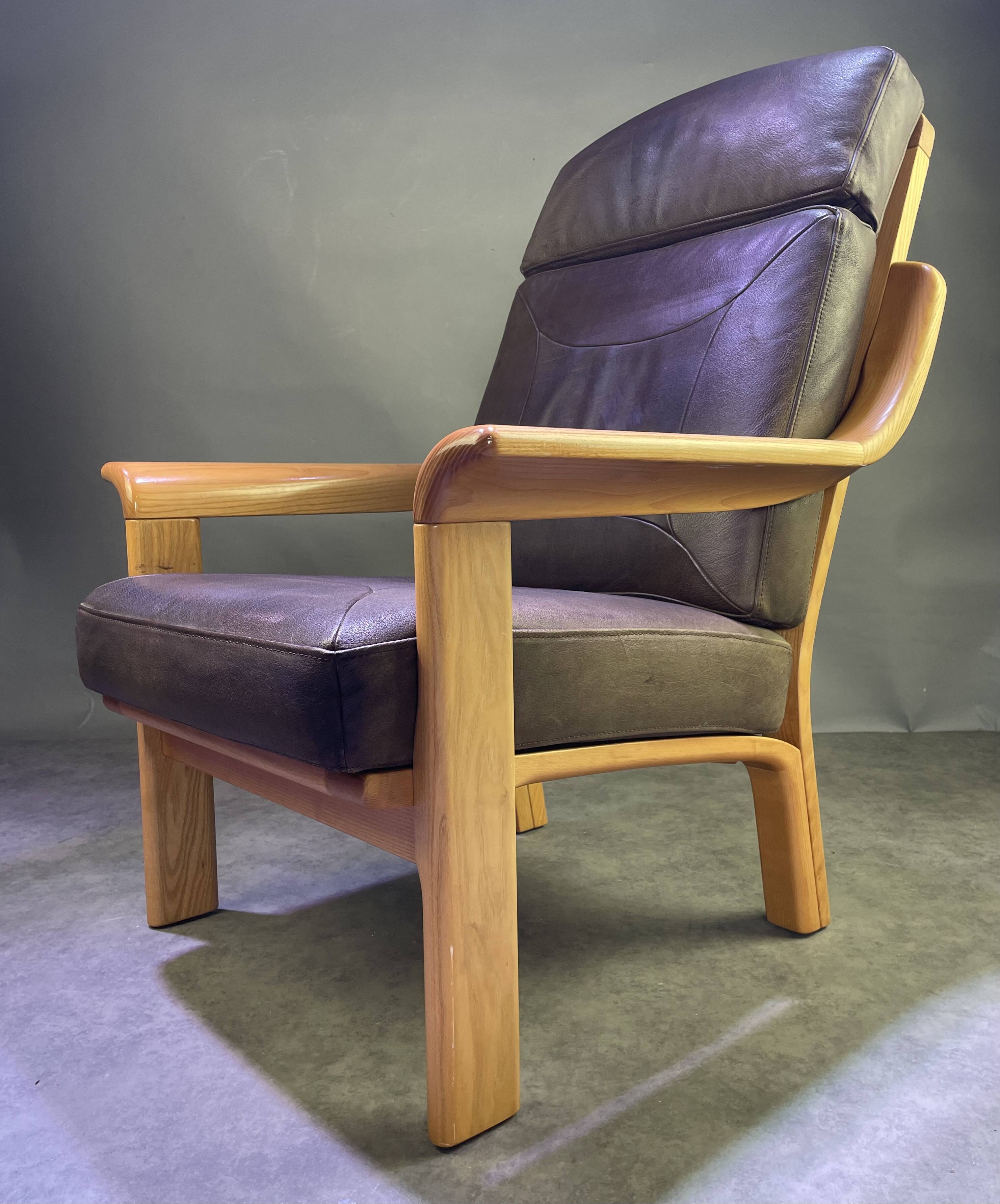 Chocolate leather armchair, wooden structure
