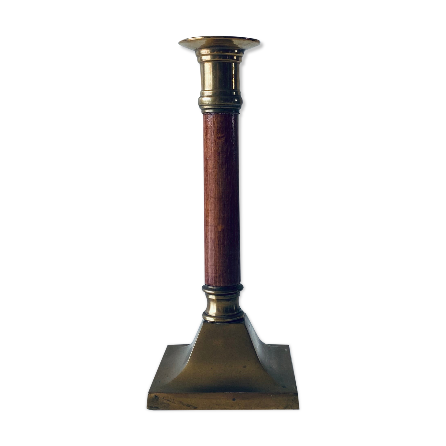 Old candle holder in brass and wood