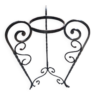 Wrought iron plant holder with scrolls