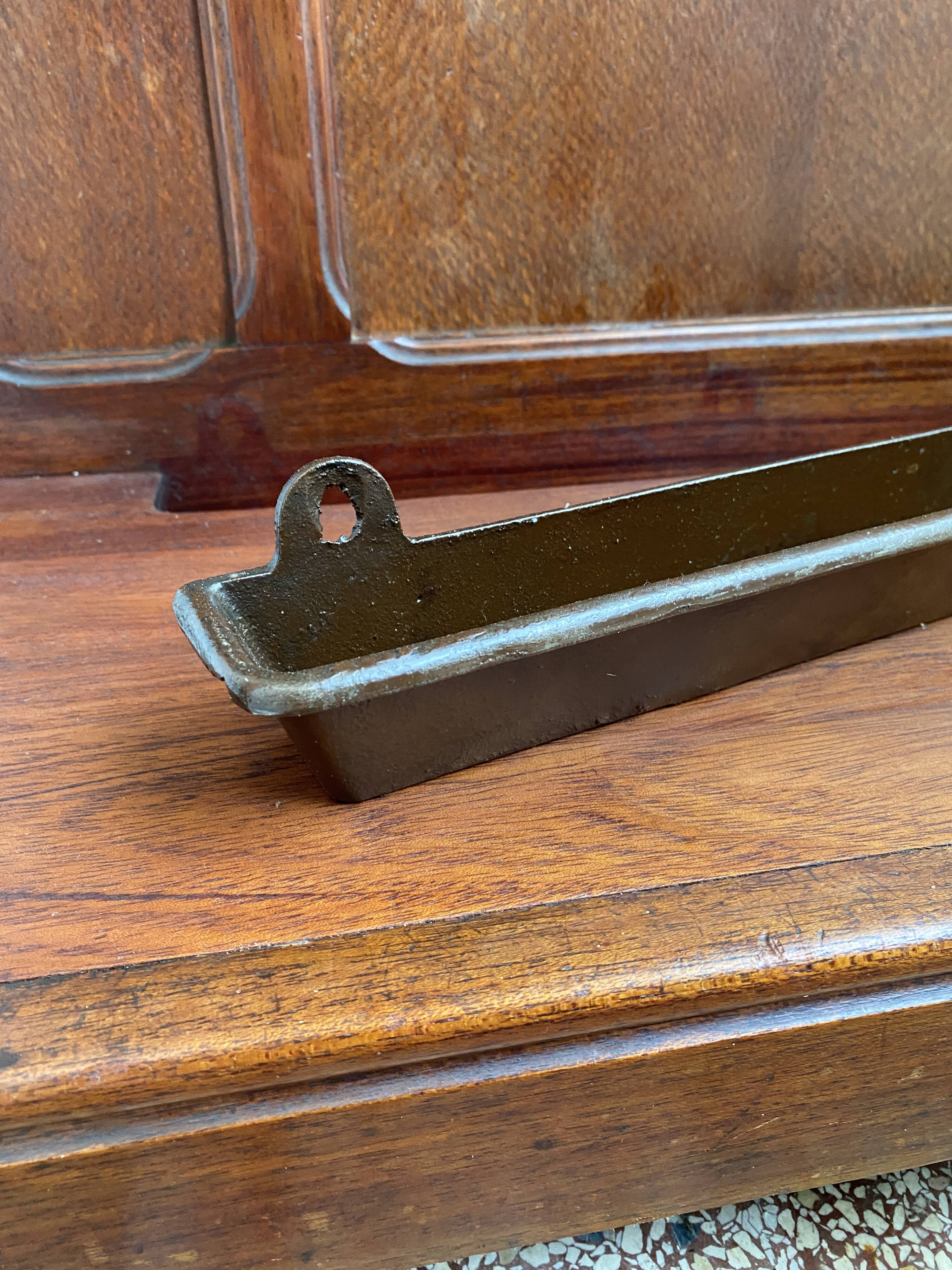 Antique wooden coat rack with mirror and shelf.