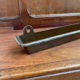 Antique wooden coat rack with mirror and shelf.