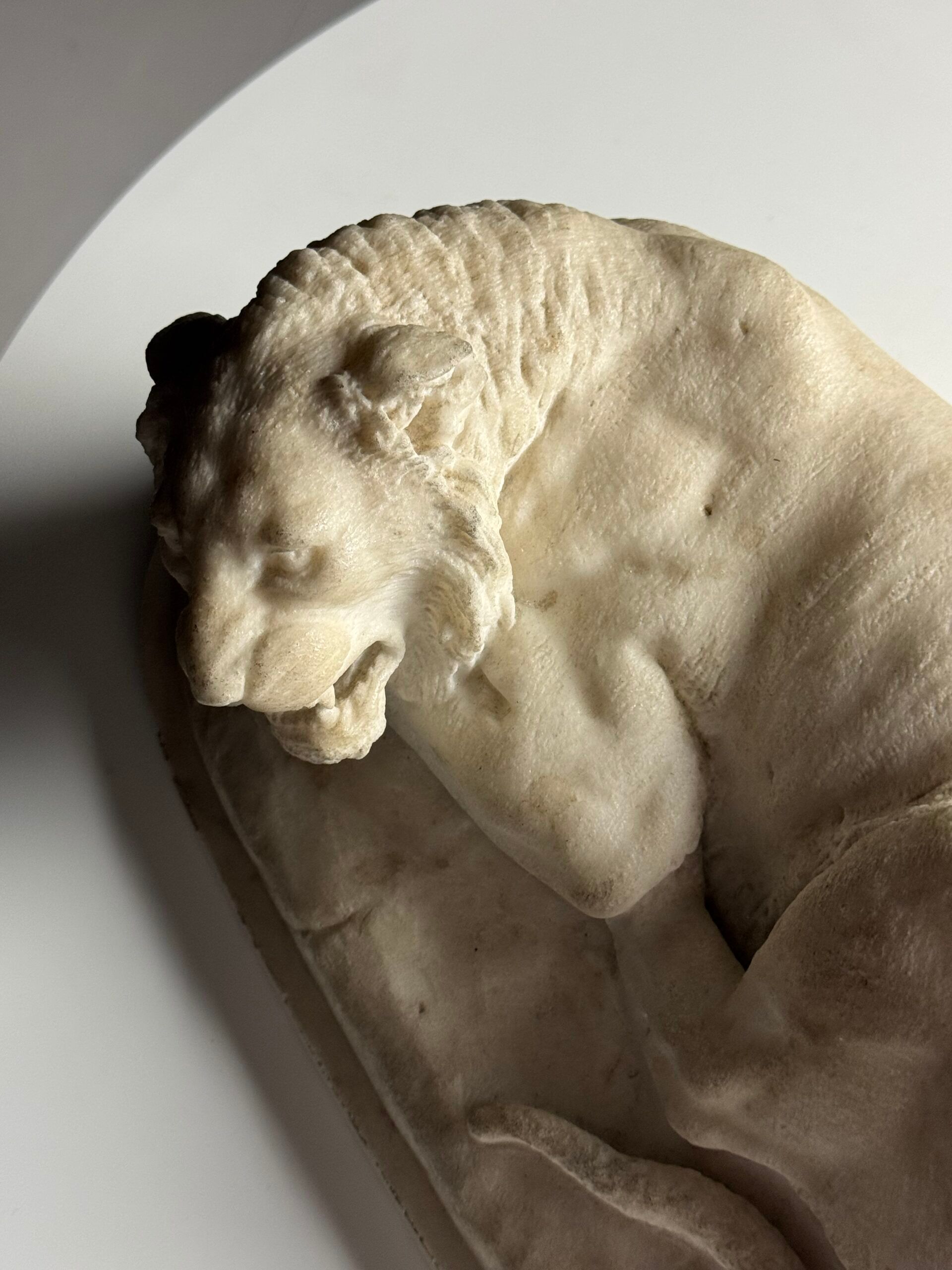 Marble sculpture of a reclining lion