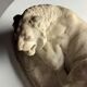 Marble sculpture of a reclining lion