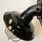 Industrial black enamel and cast iron wall lamp with iron grid, 1960s