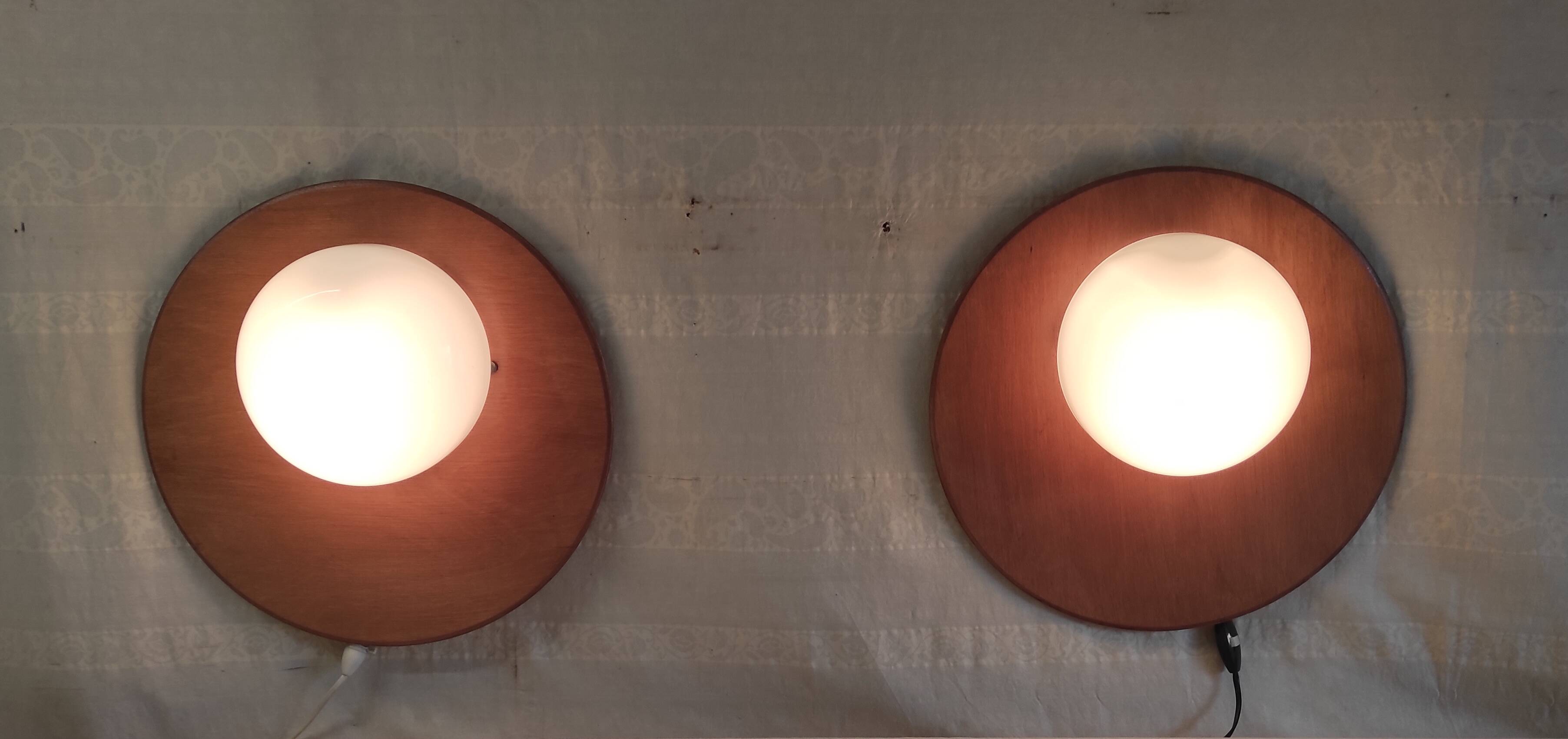 Globe-shaped wall sconces in opaline glass and wood - mid-20th century