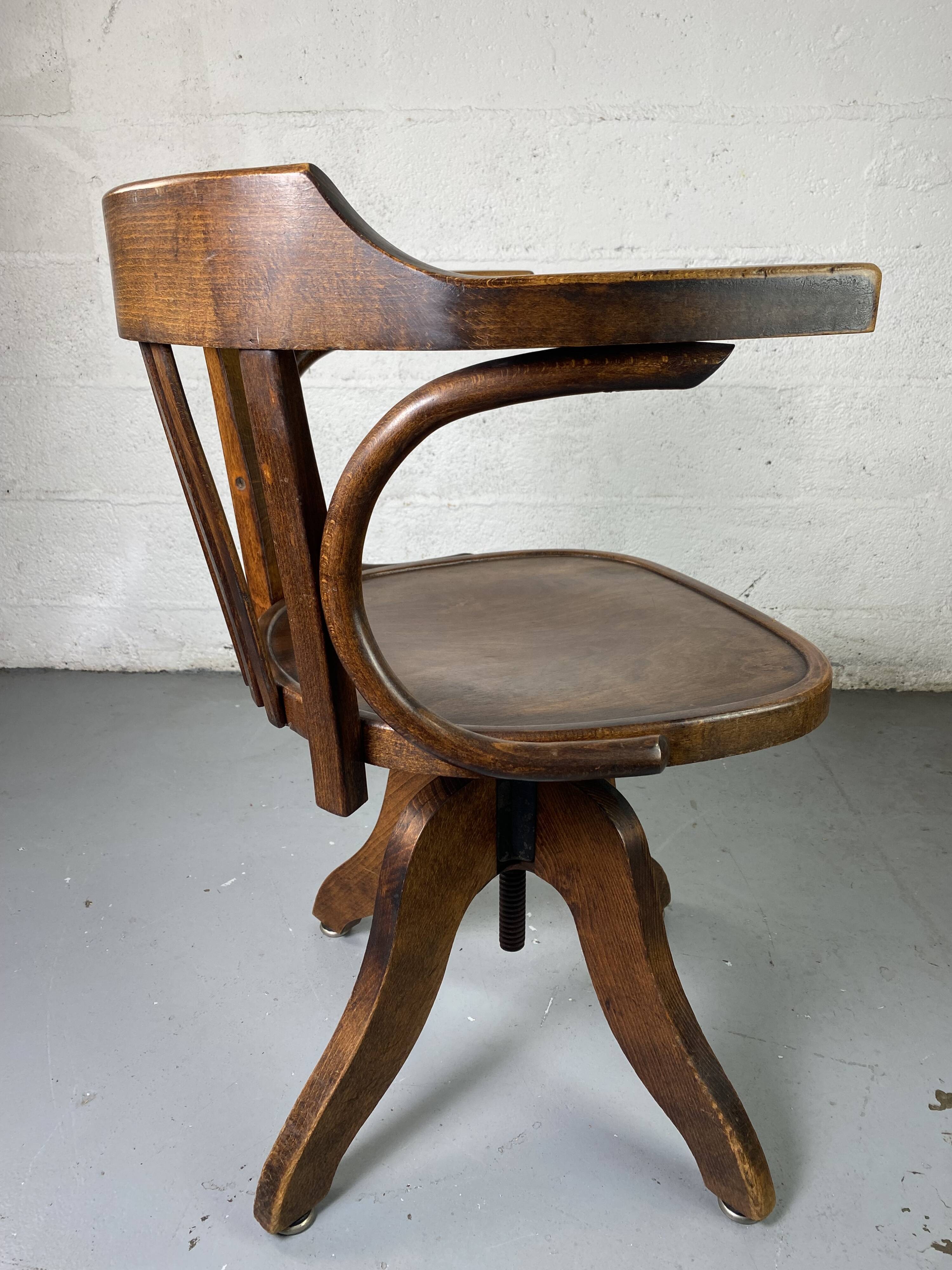 Baumann rotating wooden armchair