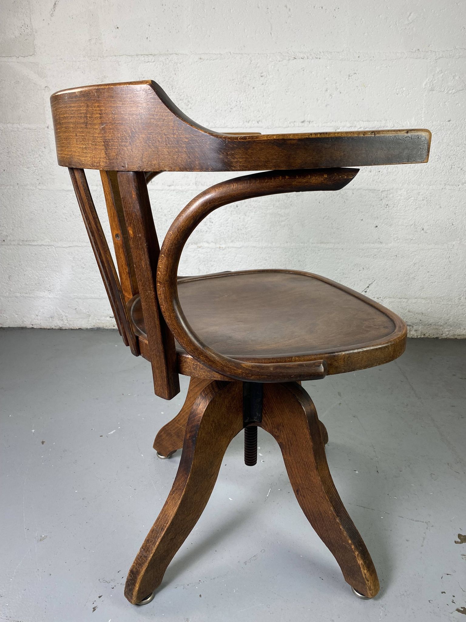Baumann rotating wooden armchair